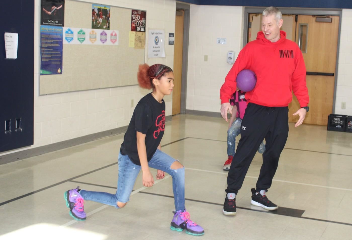 Coach Mike Kozak with student